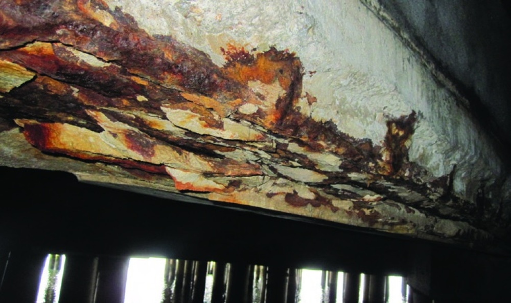 A severely corroded reinforced concrete girder.