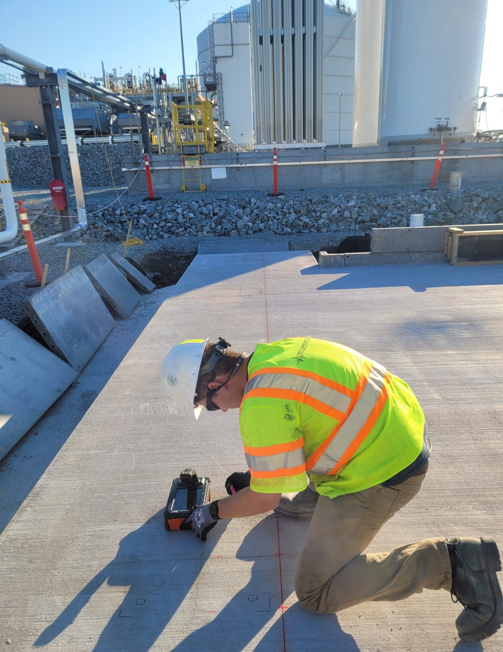 Performing ground penetrating radar (GPR) on a concrete slab.